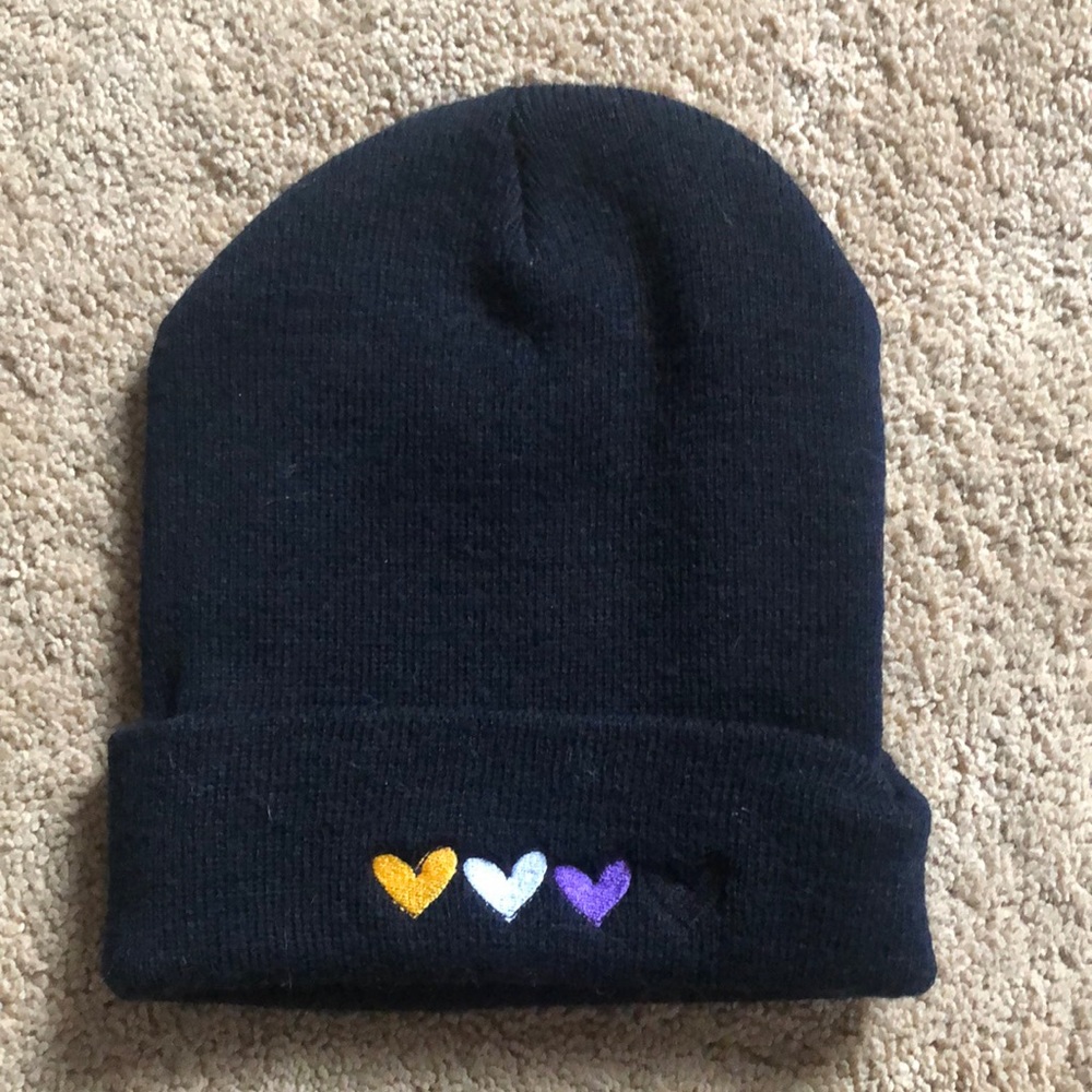 Black knit beanie with 4 hearts on brim; gold, lavender, purple & black hearts